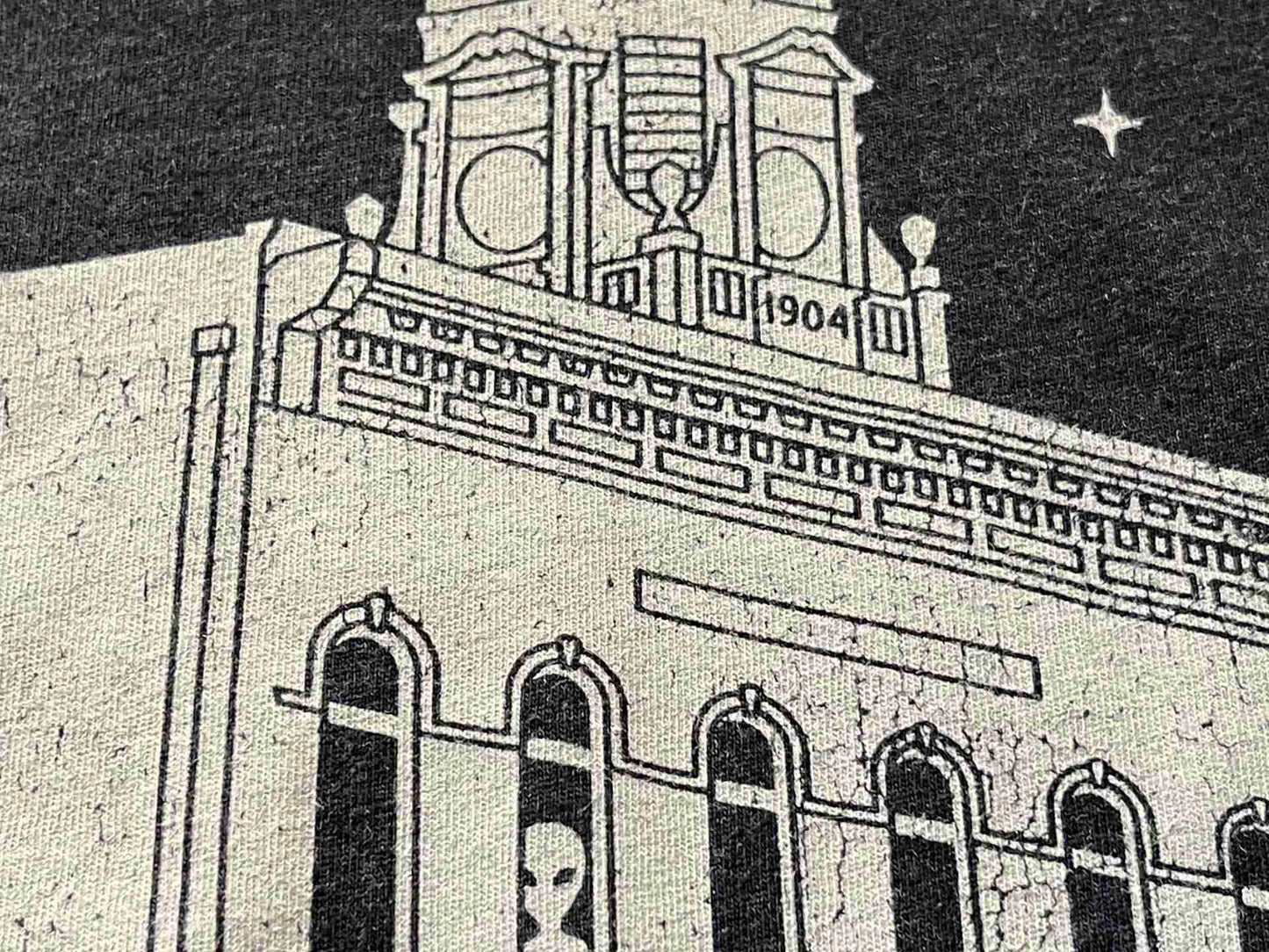 Detail image of the Pythian Castle with an alien looking out the window