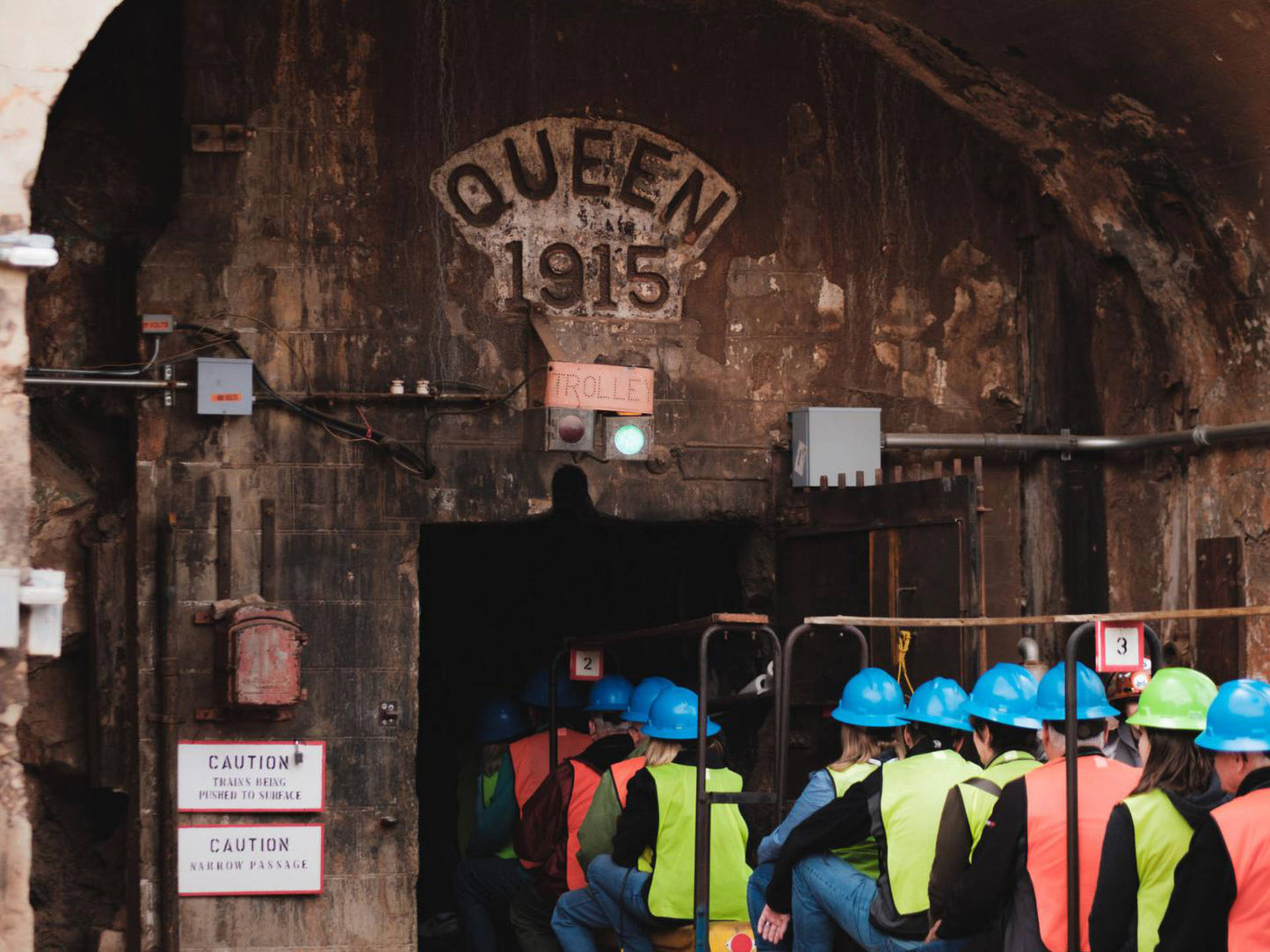 People entering the Copper Queen Mine by train